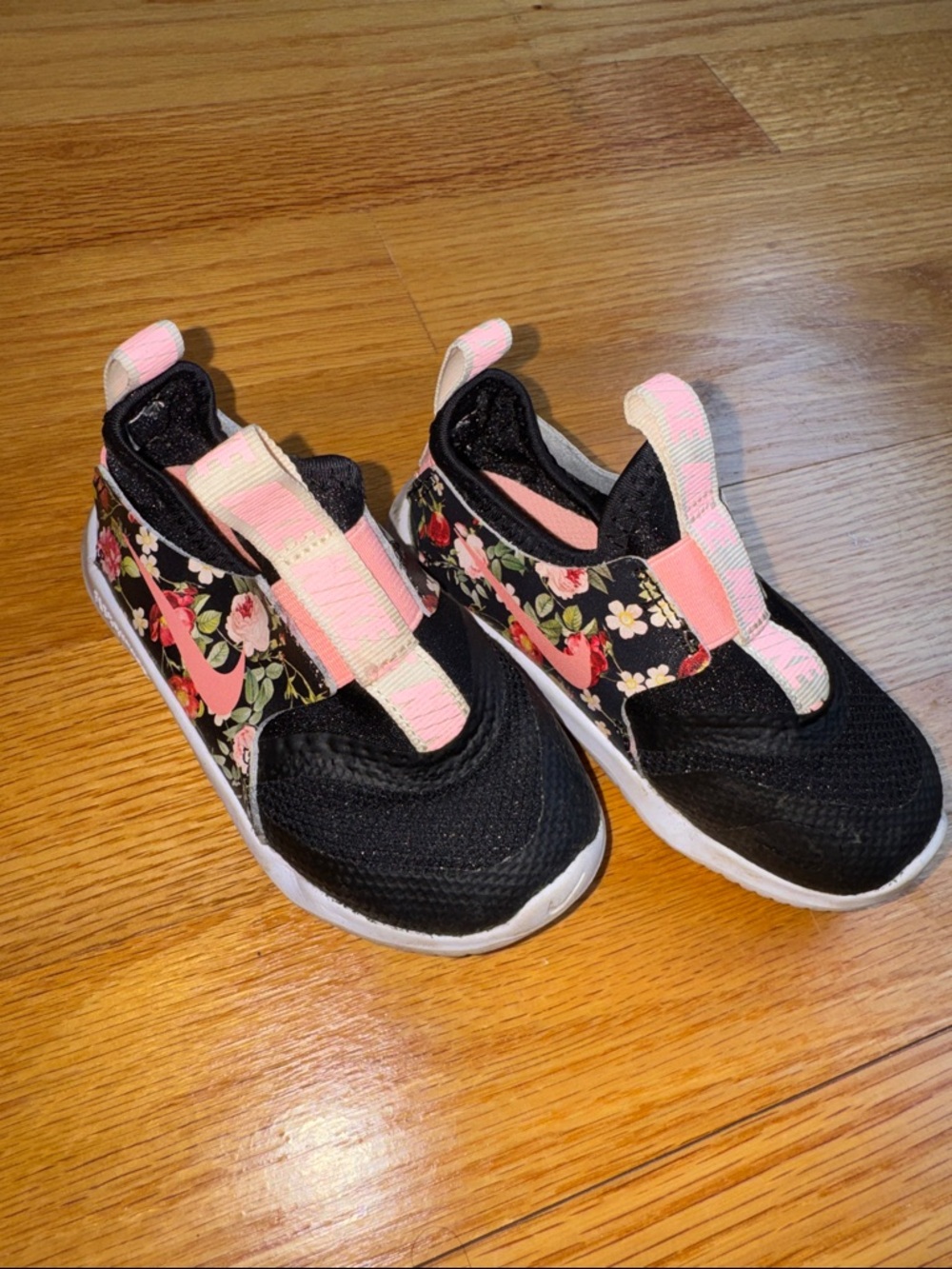 Nike Kids Black Slip-On Sneakers with Pink Floral Accents